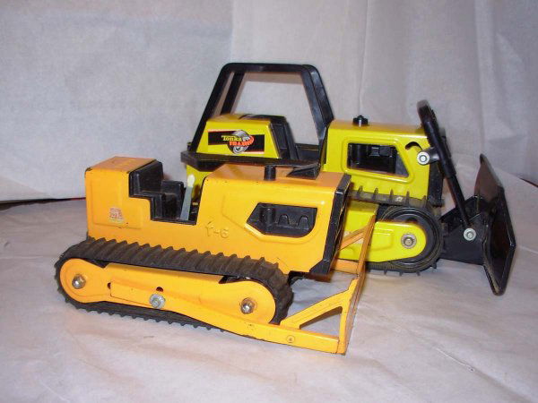 Tonka Dozer's; Trax 12" lg and T-6 8" lg. Both are: Tonka Dozer's; Trax 12" lg and T-6 8" lg. Both are in very good cond.