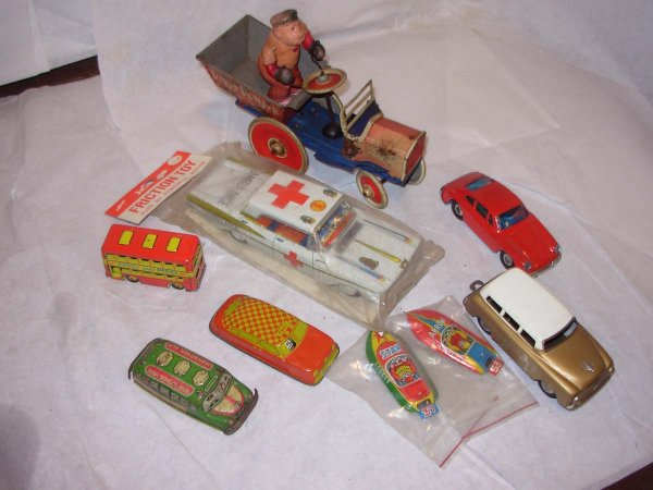 Vintage Tin & Tin Friction; Marx Dippy Dumper with: Vintage Tin & Tin Friction; Marx Dippy Dumper with, I'm guessing, Brutus. This is complete the driver is undamaged but the vehicle it self is poor to fair 1959 Ford Ambulance with original packaging,