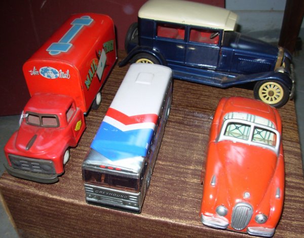 Vintage Tin & tin friction; Buddy L Greyhound Bus: Vintage Tin & tin friction; Buddy L Greyhound Bus 7 1/2" lg dated 1972, excl cond, 1925 Model A made in Japan 10" lg very good cond, a red Jaguar Roadster 7 1/2" lg some paint touch ups very good cond