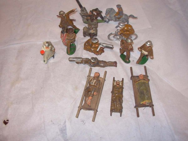 Dime Store, hollow cast 14 pieces 3" high; A. A. G: Dime Store, hollow cast 14 pieces 3" high; A. A. Gunner, Officer on Horseback, Grande Thrower w/gas mask, Potato peeler, Bicycle Rider, Nurse (piece missing from base), Flag bearer, sitting Machine Gu