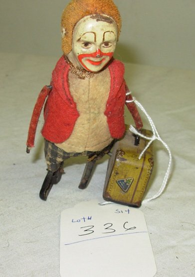 Windup tin clown with bag - original paint - Signe: Windup tin clown with bag - original paint - Signed Shuco Germany