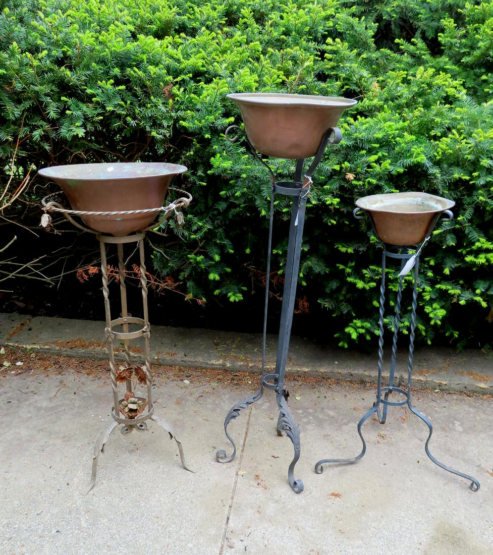 Three wrought iron floor standing planters, all with (1 of 4)
