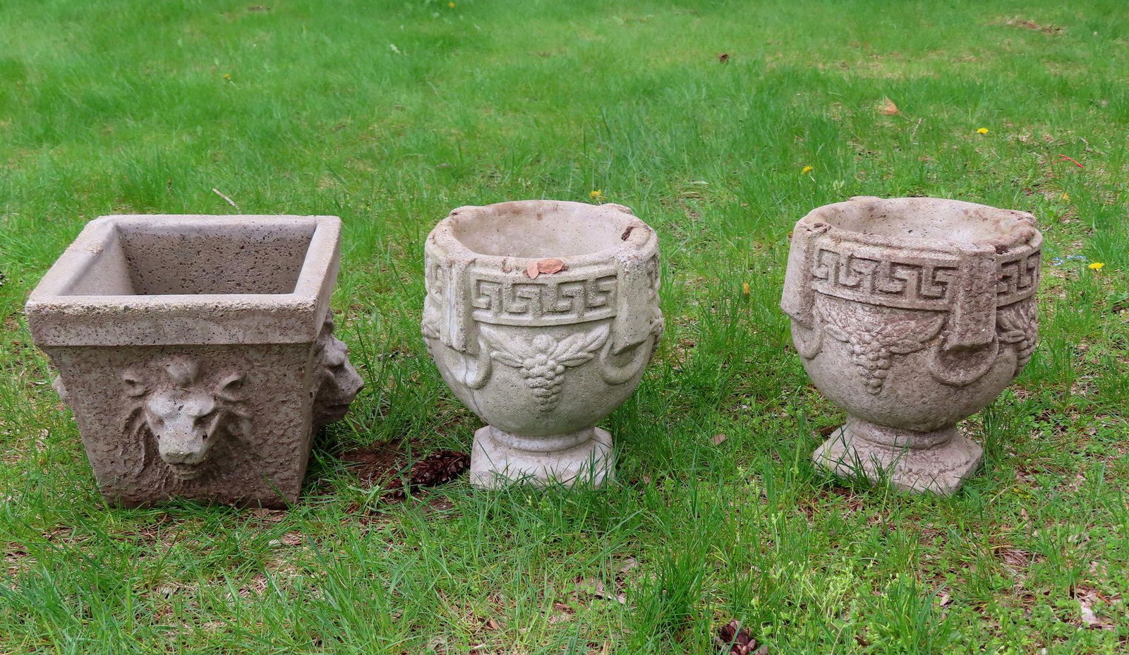 Three concrete garden urns. Two matching in the grape (1 of 2)