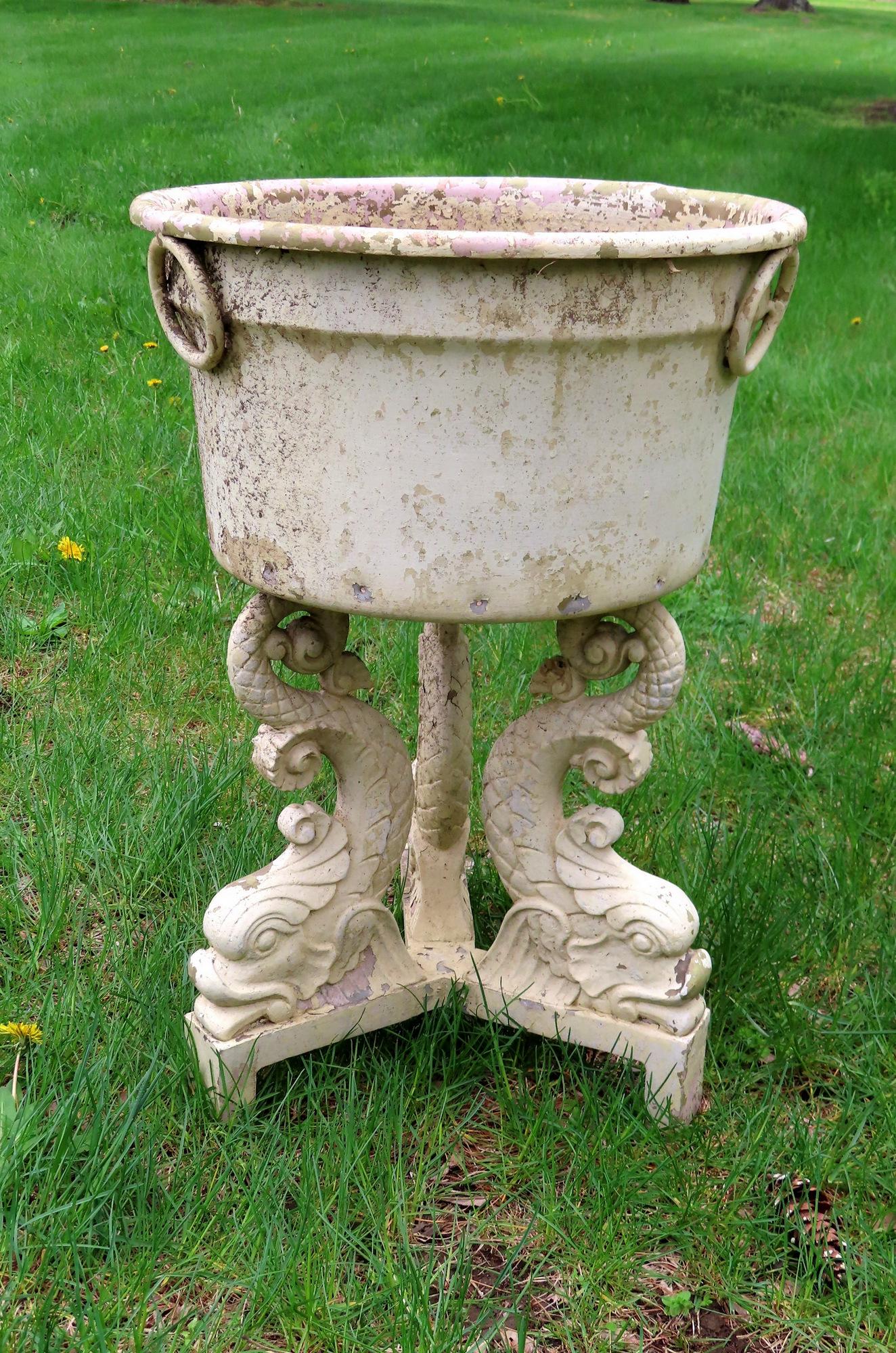 A painted metal planter having a sheet tin bowl (1 of 4)
