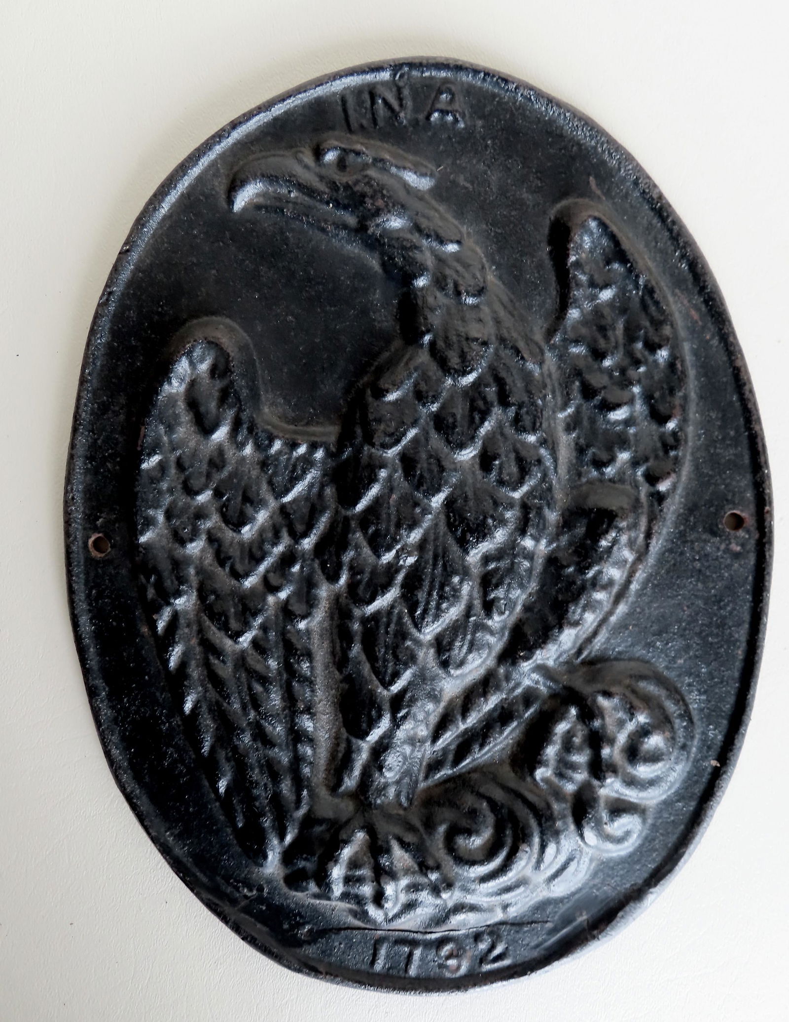 Cast iron building fire marker with an embossed image (1 of 2)