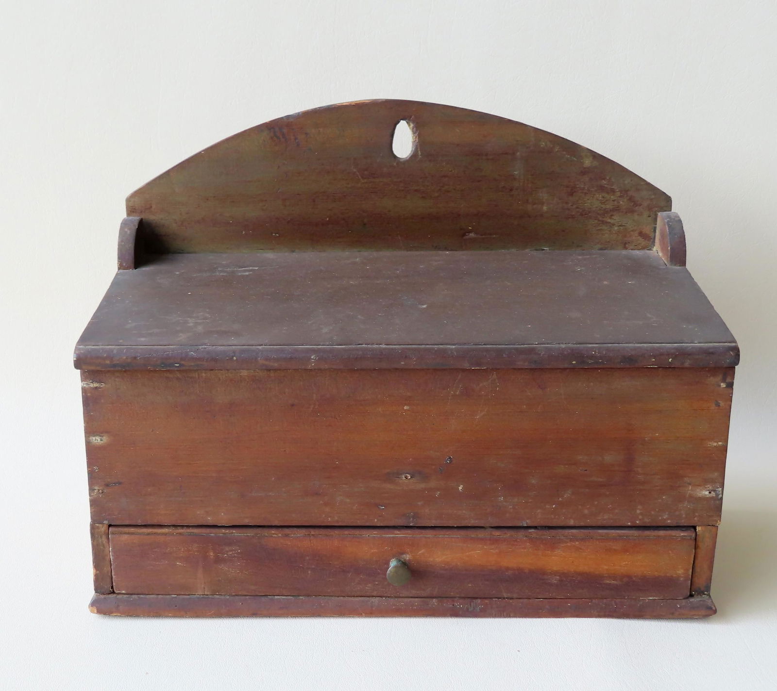 A hanging wooden spice or utility box having lid with (1 of 4)