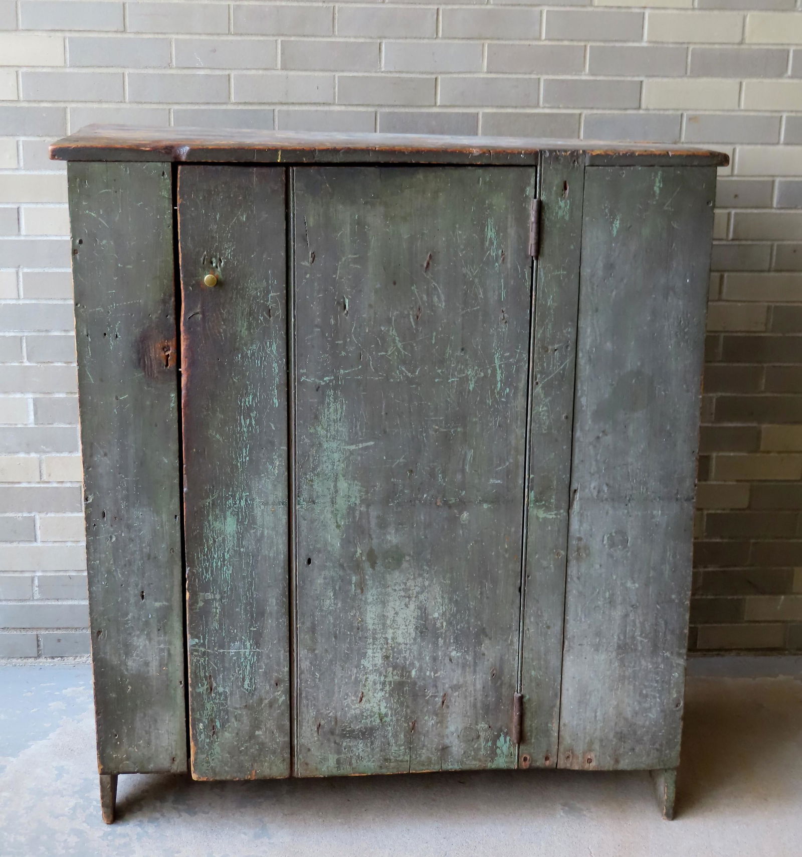 A primitive 1 door cupboard in old green paint, (1 of 9)