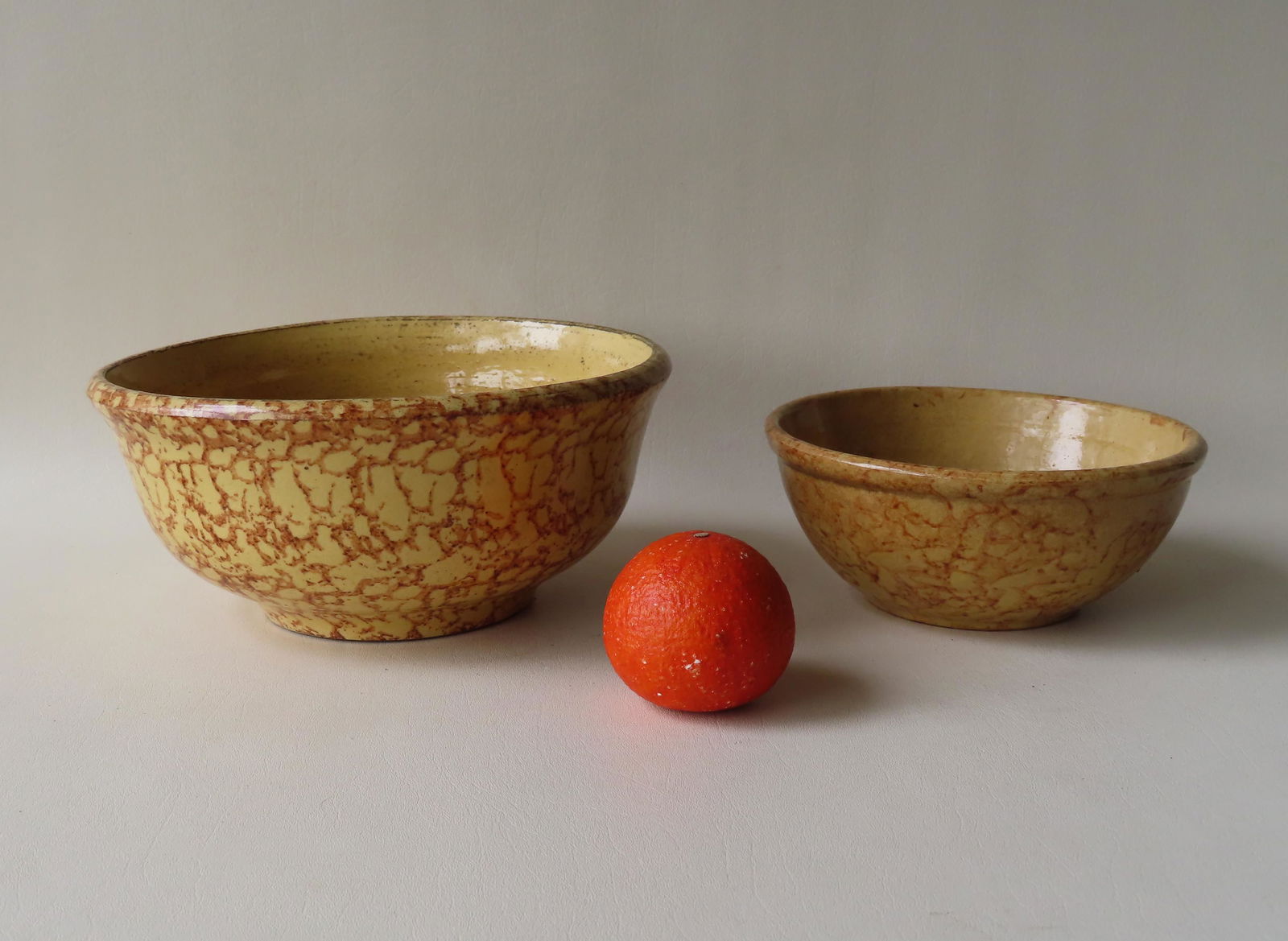 Two yellowware mixing bowls with brown sponge (1 of 8)