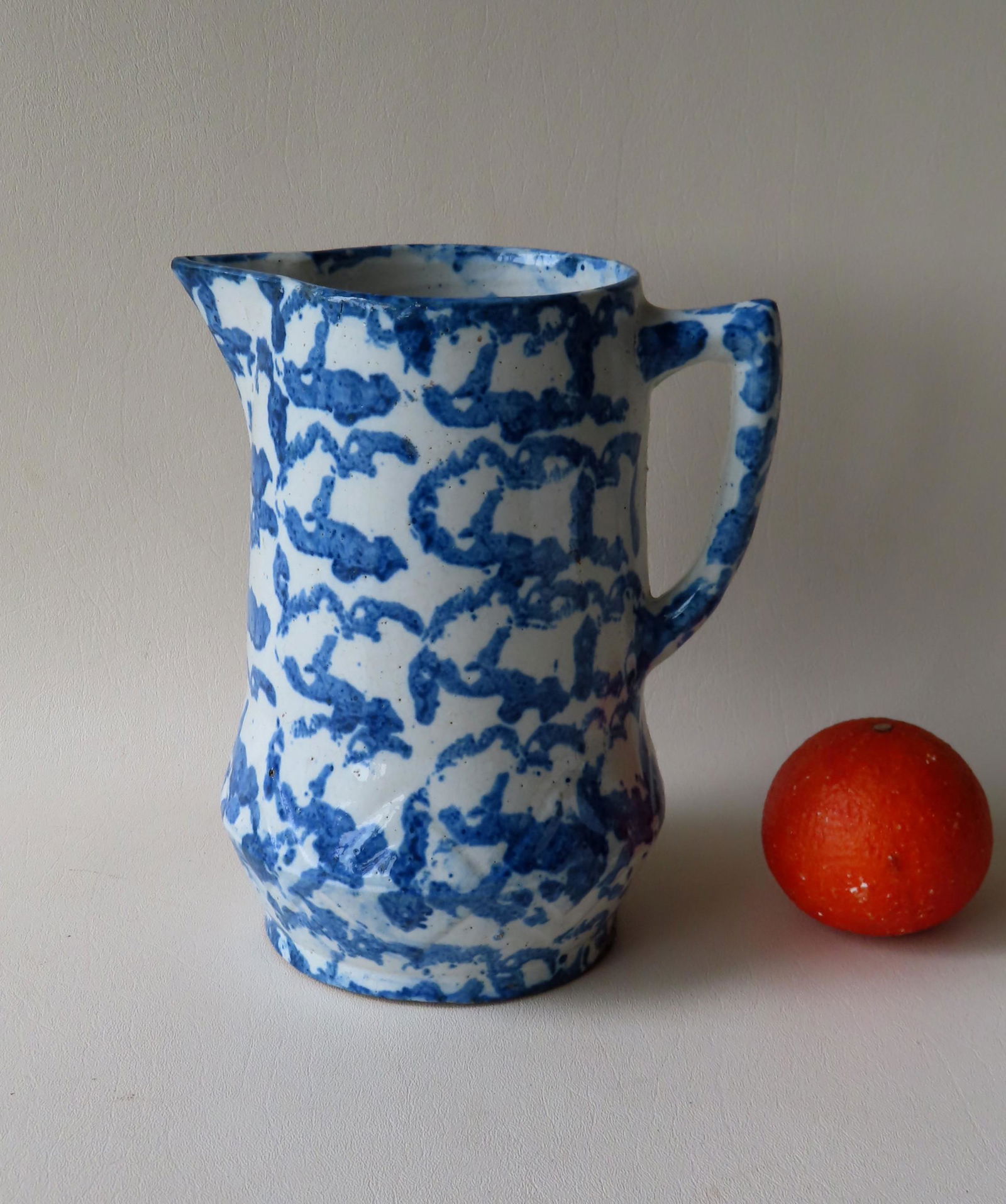A blue and white spongeware pitcher, with embossed (1 of 4)