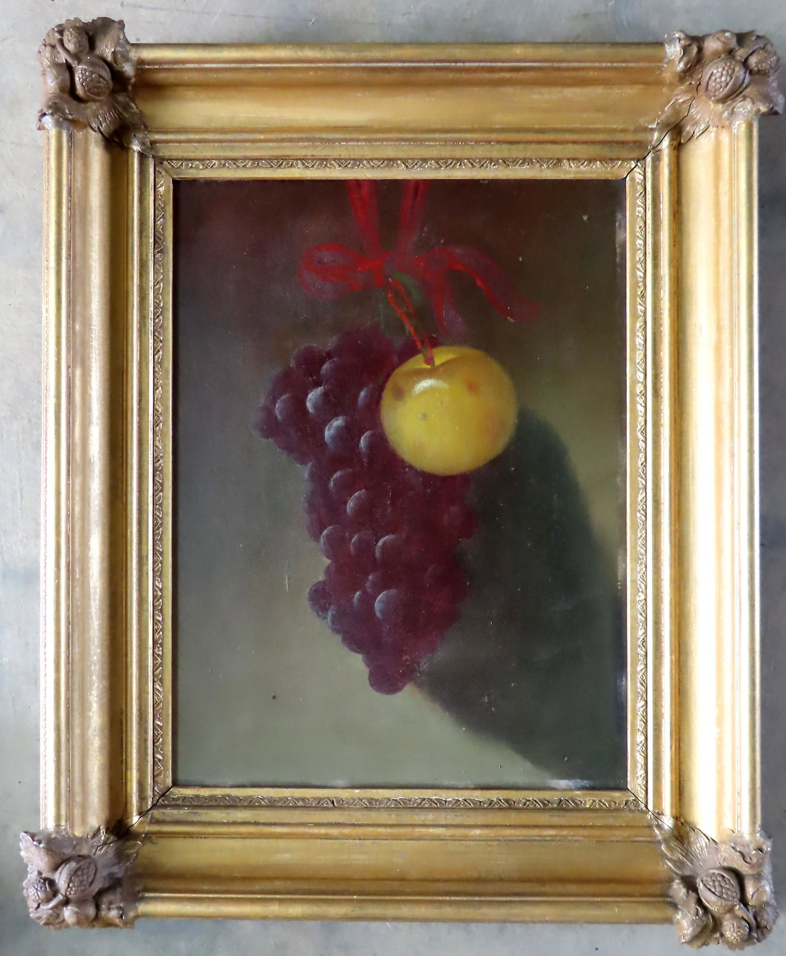 O/B Still life of apples and grapes in an outstanding: O/B Still life of apples and grapes in an outstanding lemon gold frame with gesso leaves and nuts applied to all 4 corners, all original - both the frame and the artwork are in very good condition. Bo