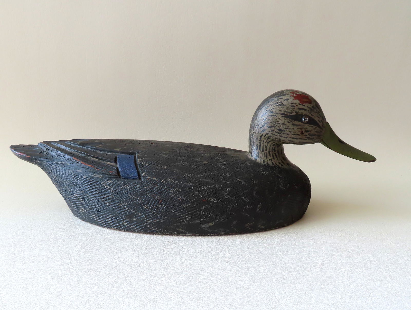 Hand carved wooden black duck decoy with carved beak (1 of 6)