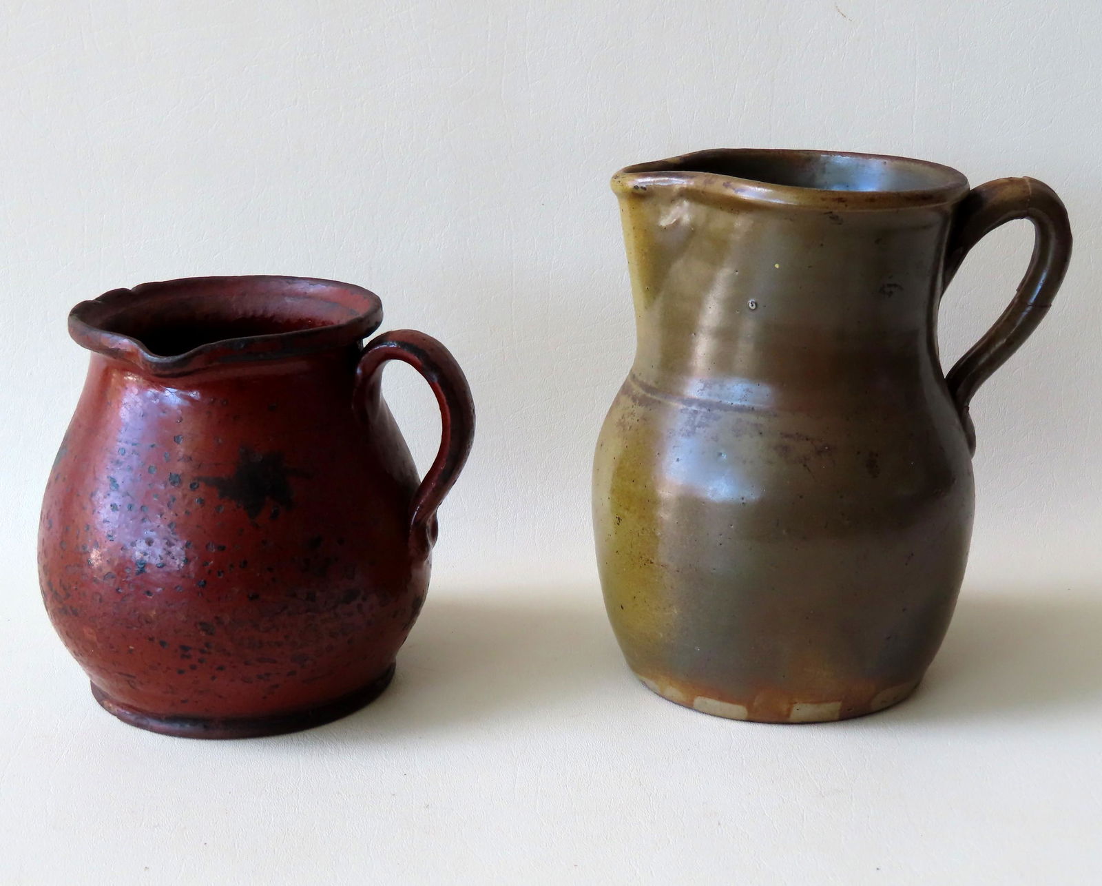 Two redware pieces including a pitcher with a (1 of 10)