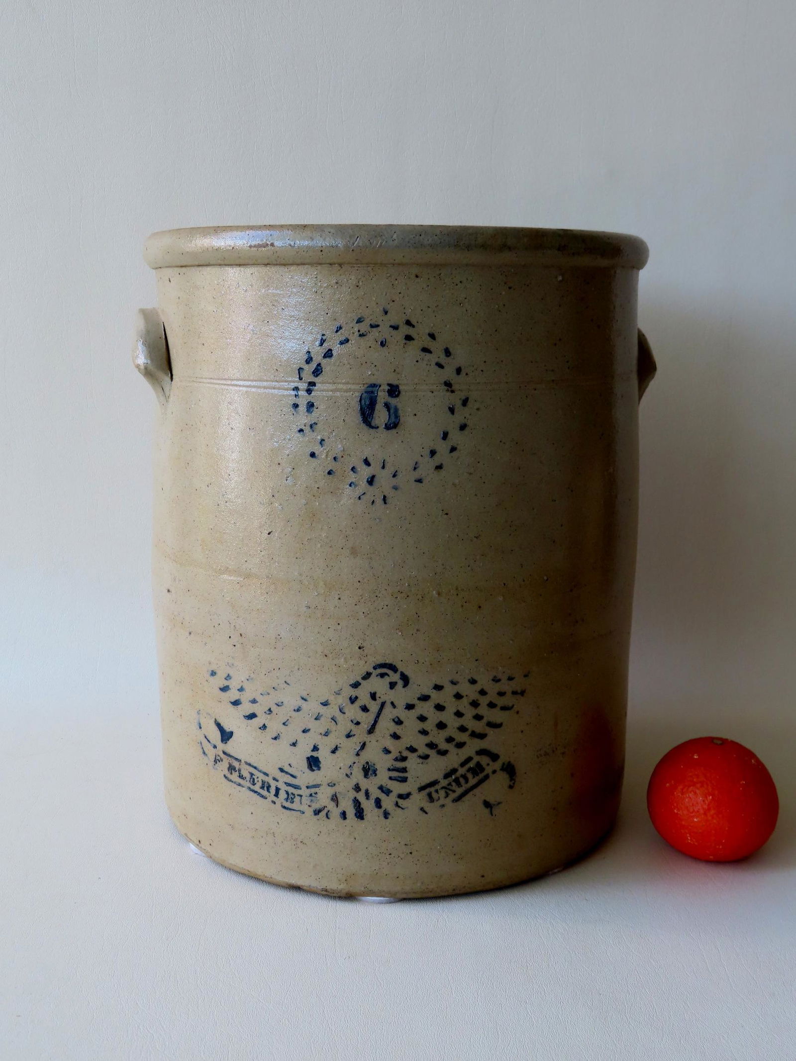 A large stoneware crock, 6 gallon, decorated with a (1 of 5)