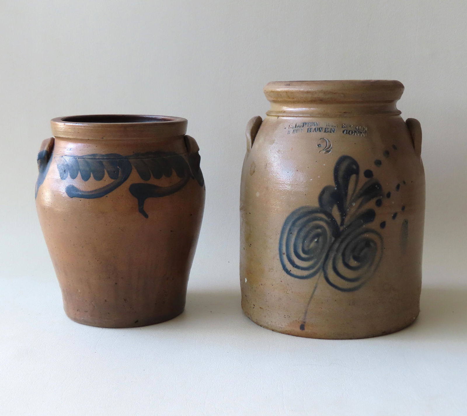 Two stoneware crocks including: The first, with the (1 of 11)