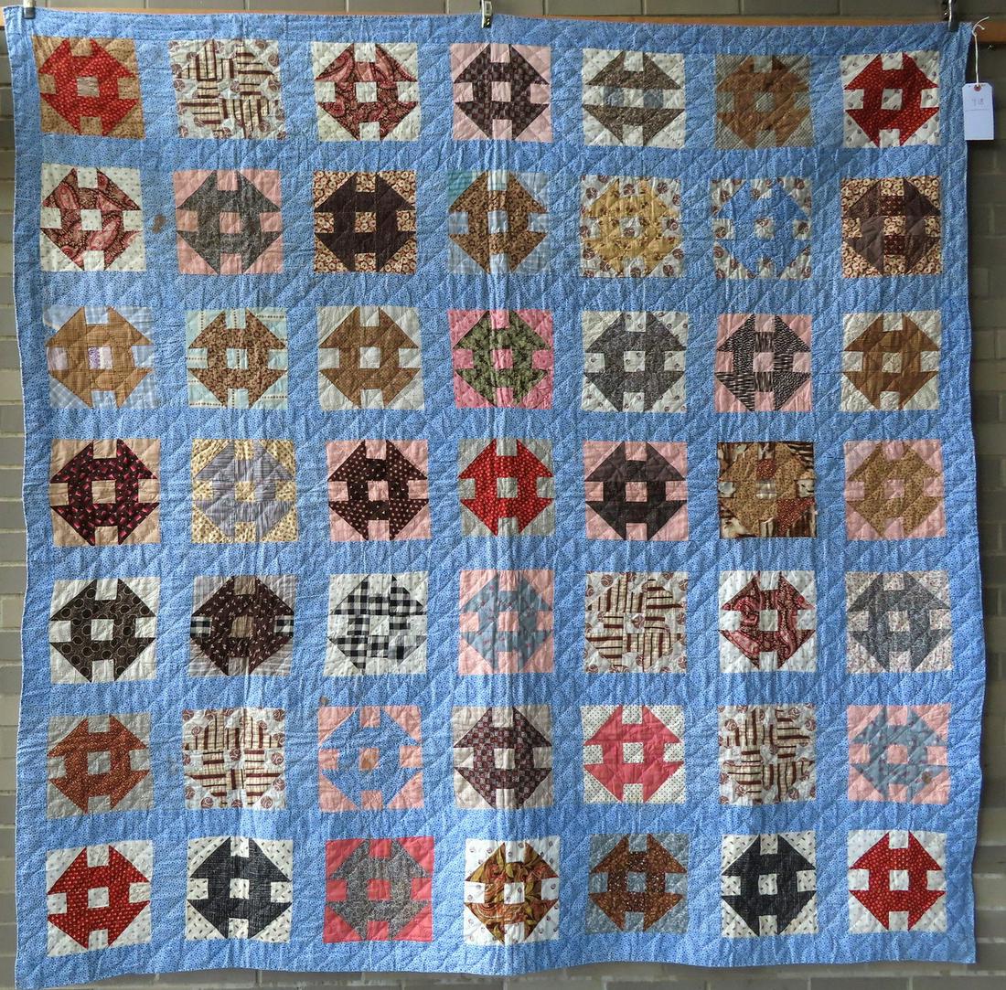 A patchwork quilt in the Churn Dash pattern, hand sewn, (1 of 7)