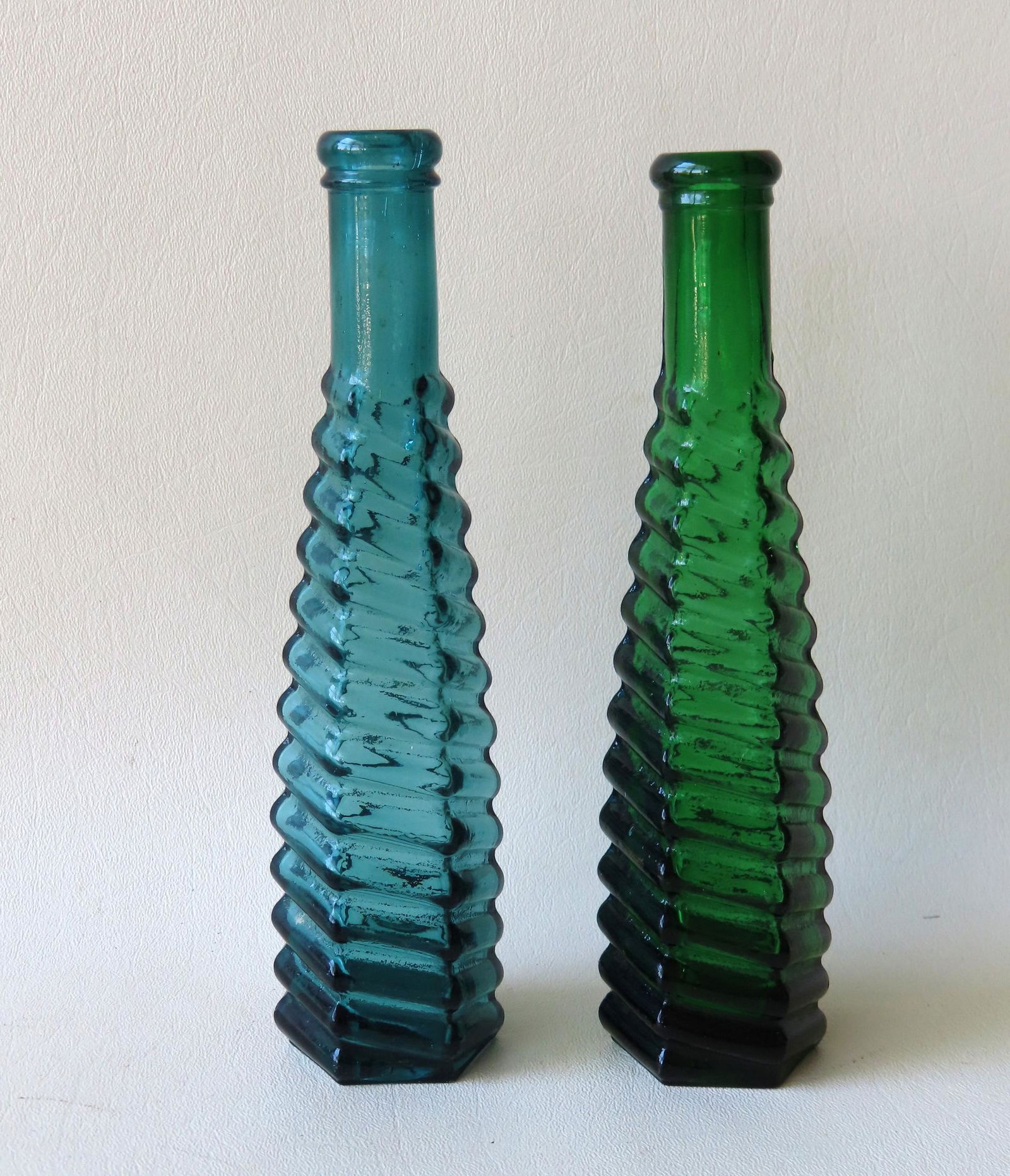 Two spiral octagonal pepper sauce bottles, green and (1 of 4)