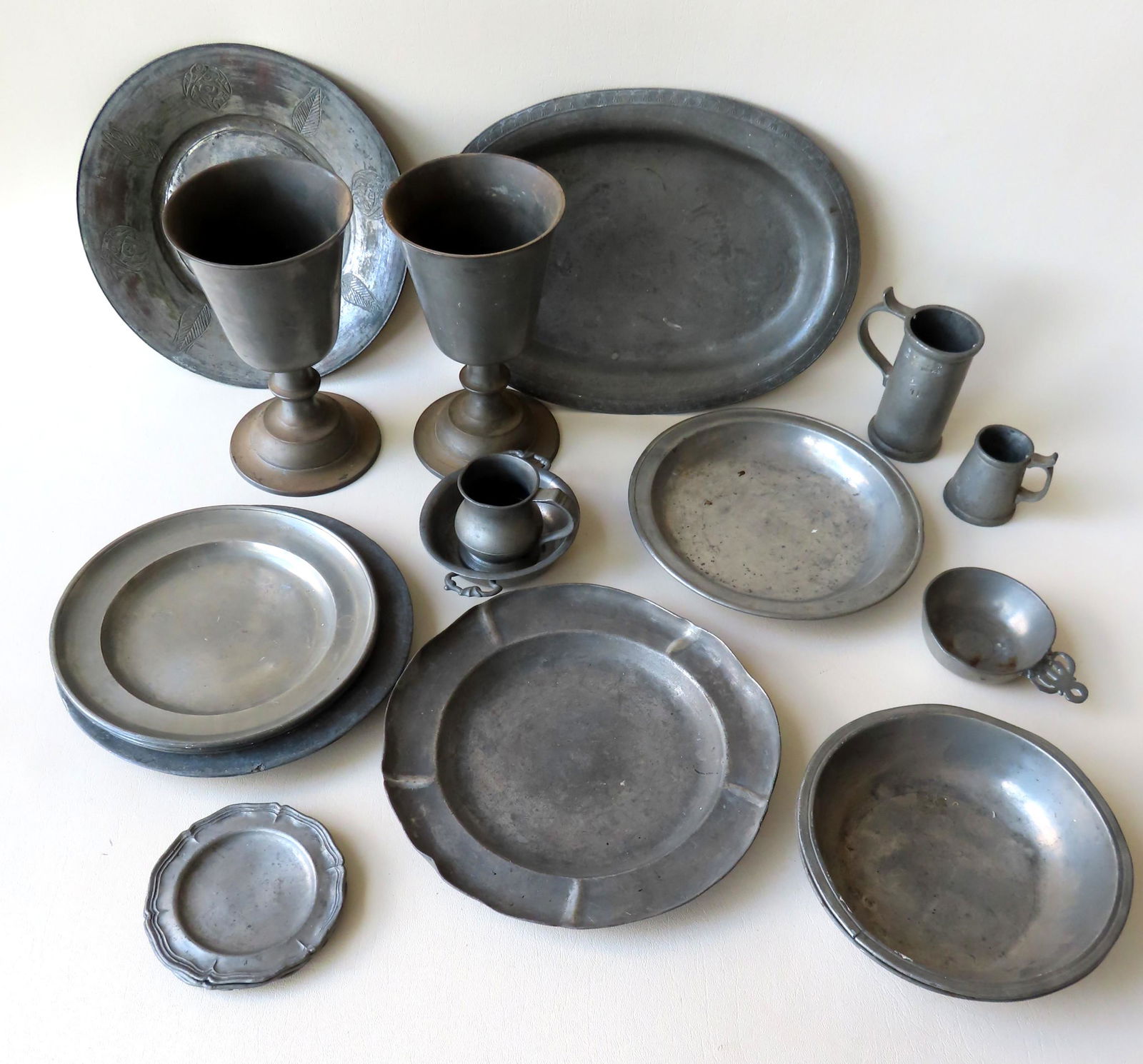 A grouping of early pewter objects including: A small (1 of 17)