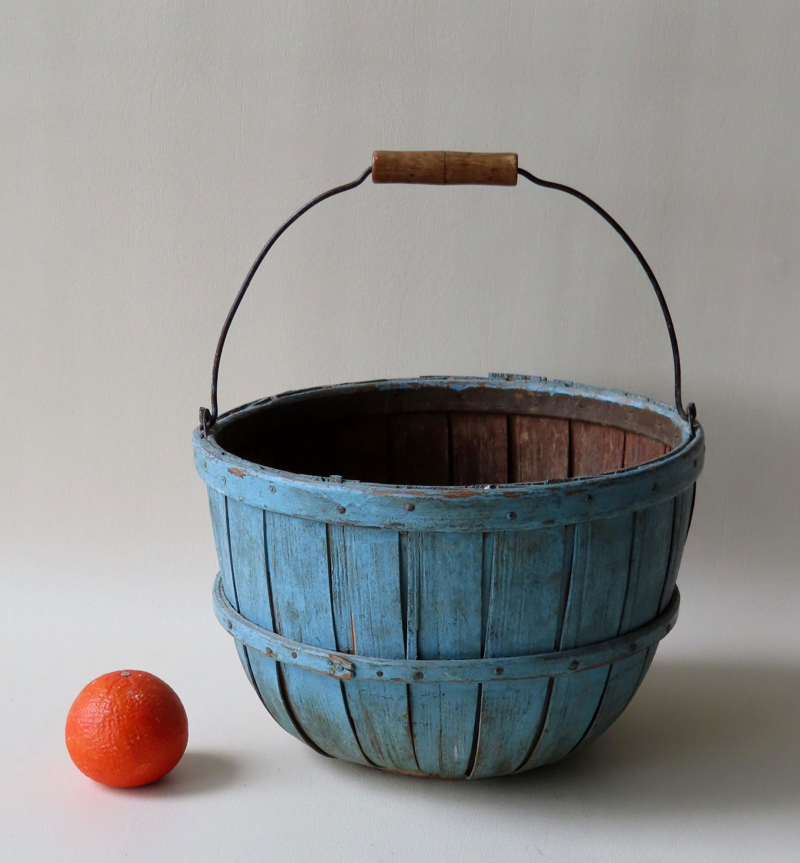 An apple basket with bale handle in old blue paint, (1 of 4)