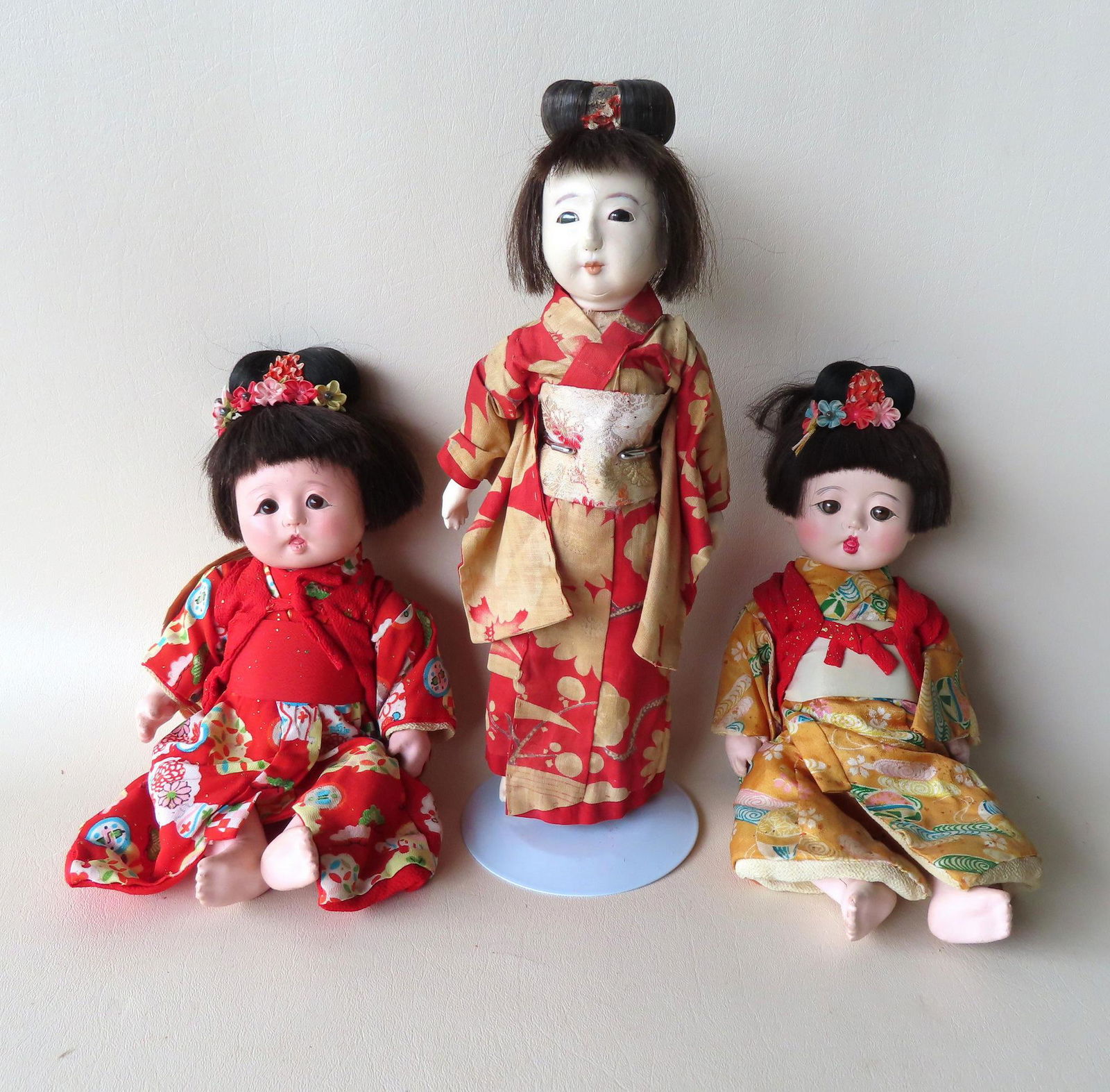 Grouping of 3 Japanese dolls including: A traditional (1 of 12)
