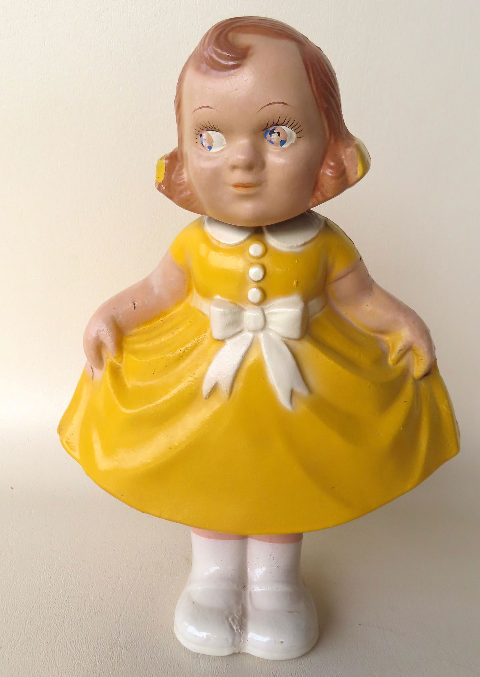 A Bobbi Mae Swing and Sway composition doll in yellow (1 of 3)