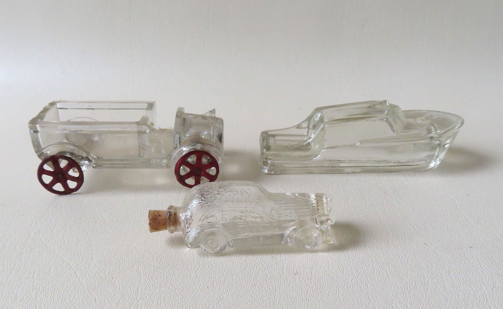 Three glass candy containers and a vintage "Remember (1 of 4)