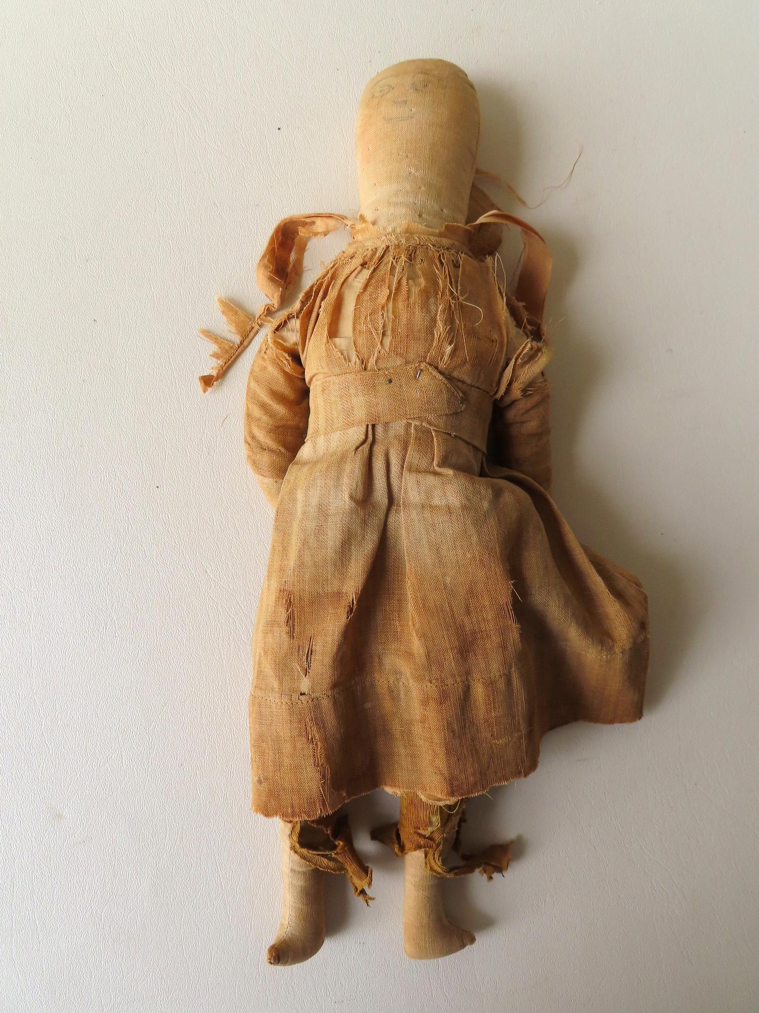 An early hand made cloth doll with hand painted face (1 of 3)