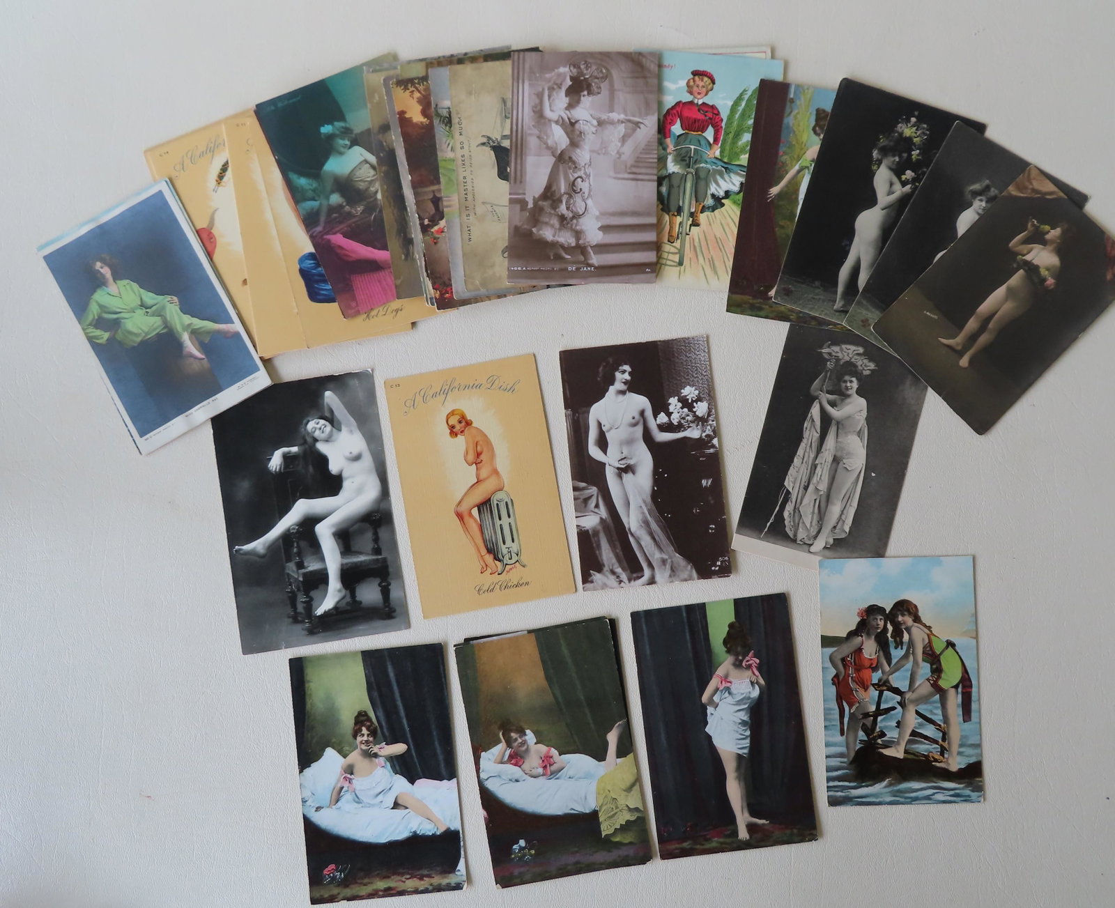 Grouping of 42 risque, swimsuit, whimsical, and pinup: Grouping of 42 risque, swimsuit, whimsical, and pinup postcards of ladies, some photo postcards including: 10 pinups titled "A California Dish" - unused and in very good condition; 2 photo postcards o