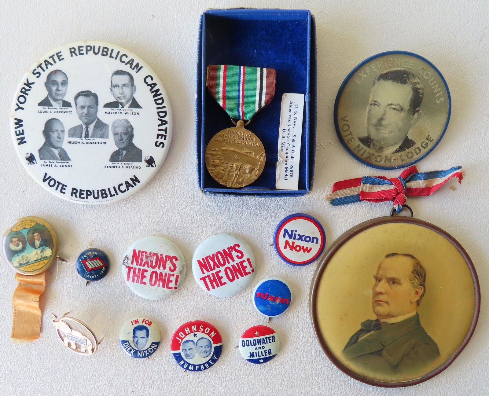 A grouping of mostly politcal buttons and medal (1 of 6)