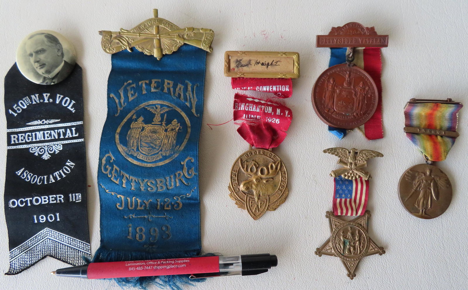 A grouping of various medals including: Three GAR: A grouping of various medals including: Three GAR medals and ribbons 1886-1893 , 150th NY Vol. Regimental Association 1901, Order Of Moose convention 1926, and a WWI France service medal. Most in good
