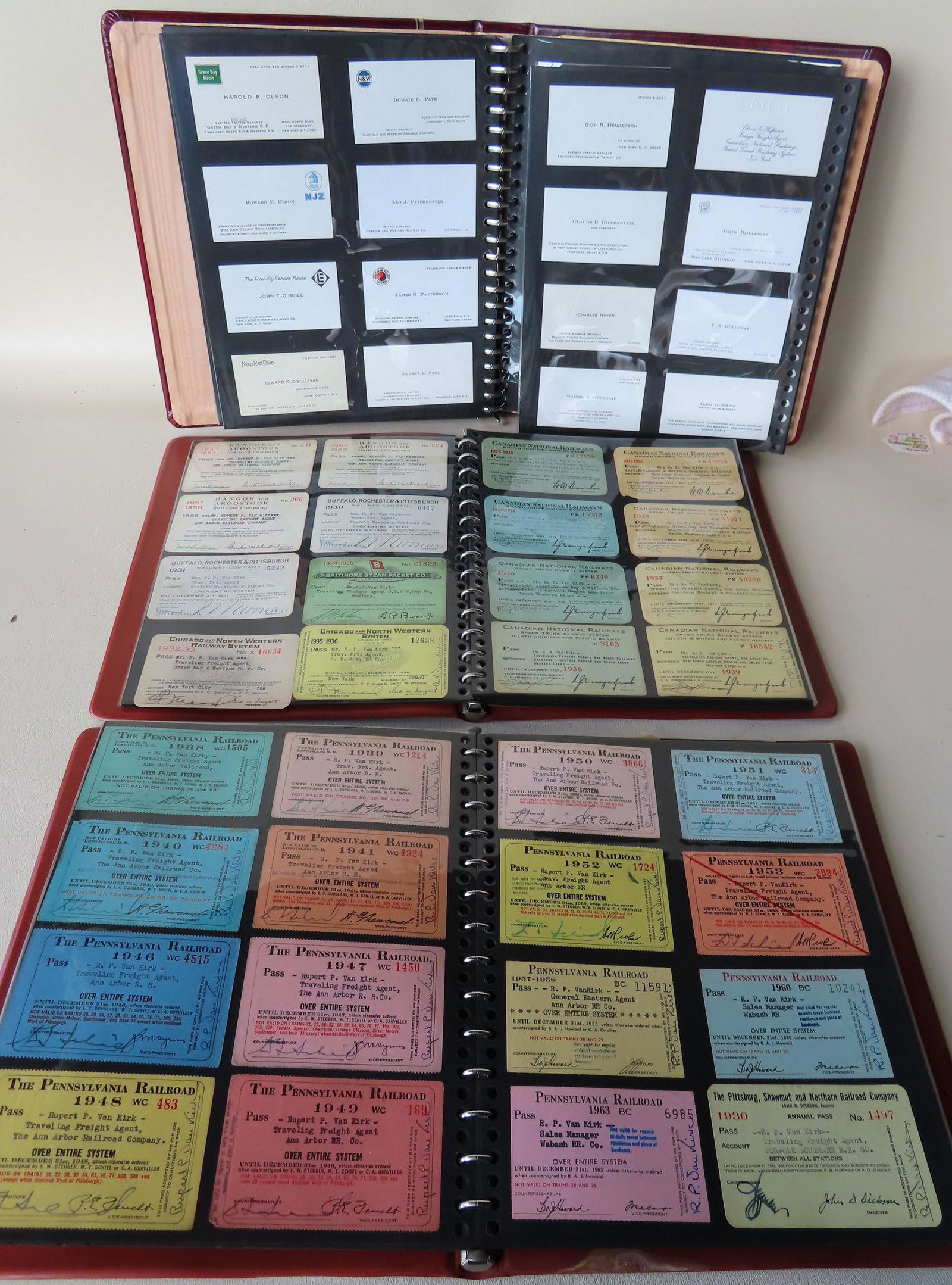 Grouping of railroad related memoribilia related to the: Grouping of railroad related memoribilia related to the work of Rupert P. Van Kirk, including: 2 albums of mostly Traveling Freight Agent cards from many different railroads 1930-1960's, an album of b