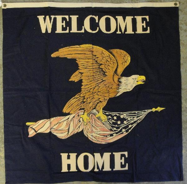 Two WWII Welcome Home wall flags in red, white and b: Two WWII Welcome Home wall flags in red, white and blue with spread wing eagle in center.