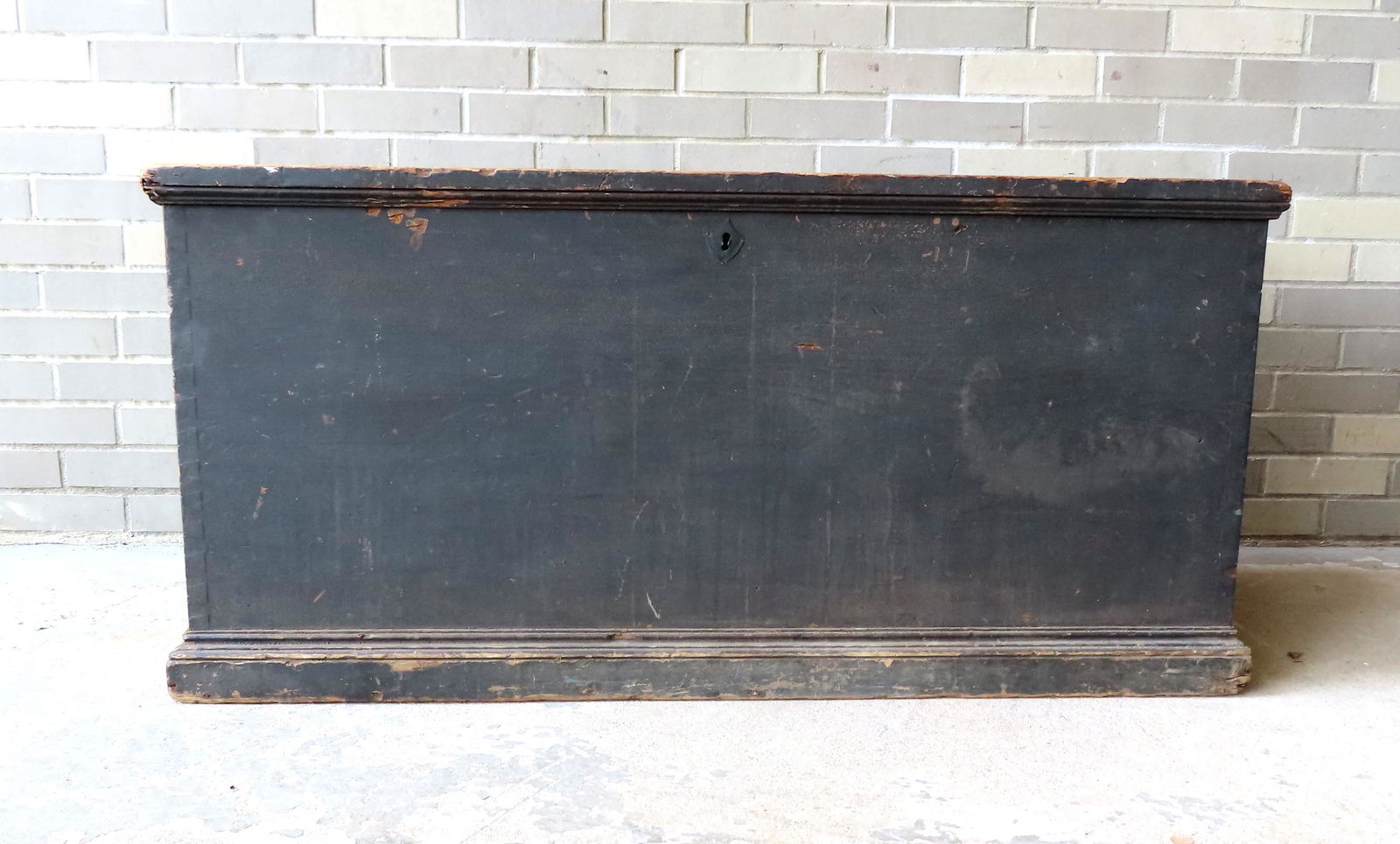 A Mohawk Valley blanket box in original blue/green: A Mohawk Valley blanket box in original blue/green paint, with interior till and secret drawer, rattail hinges, side iron handles, and a good molded base. The back is signed in old script "A.H. Curtis