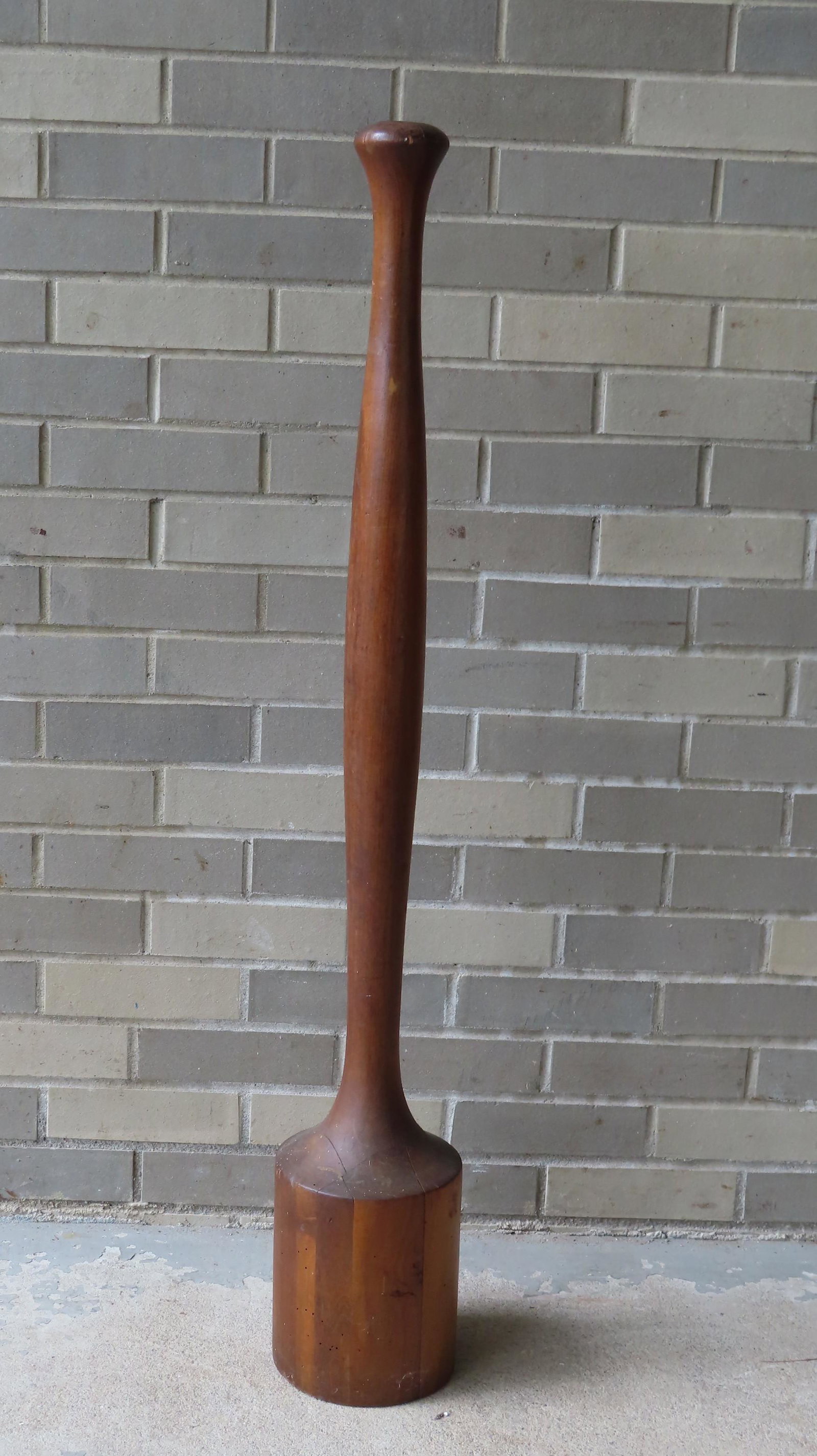 Large turned wood pestle, 19th century. Slight age: Large turned wood pestle, 19th century. Slight age checks, otherwise good condition. 45"H.