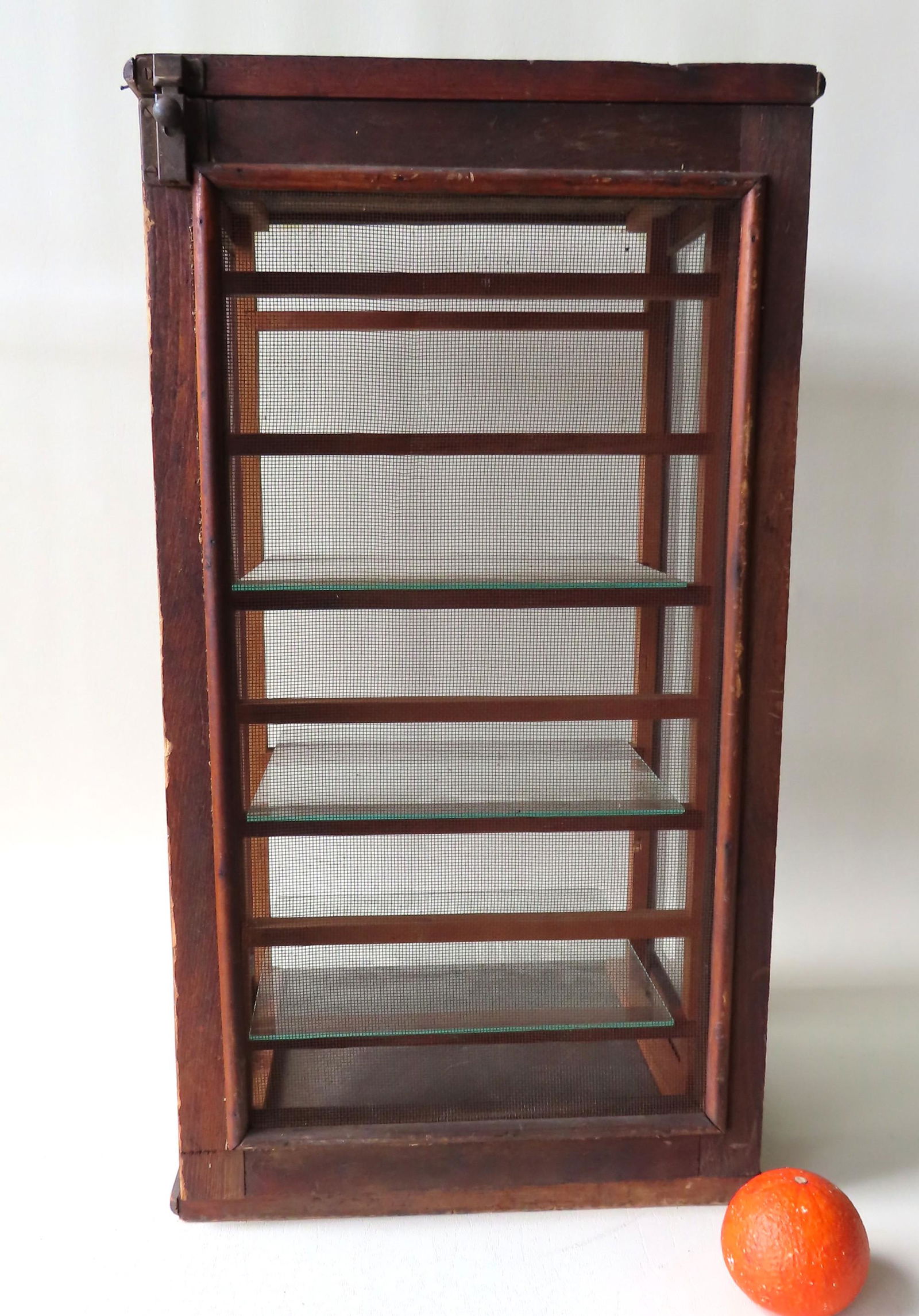 Table top country store screened pie safe with 3 glass: Table top country store screened pie safe with 3 glass shelves. Good condition. Late 19th century. Measures 14 1/4"W x 13 1/4"D x 25 1/2"H.