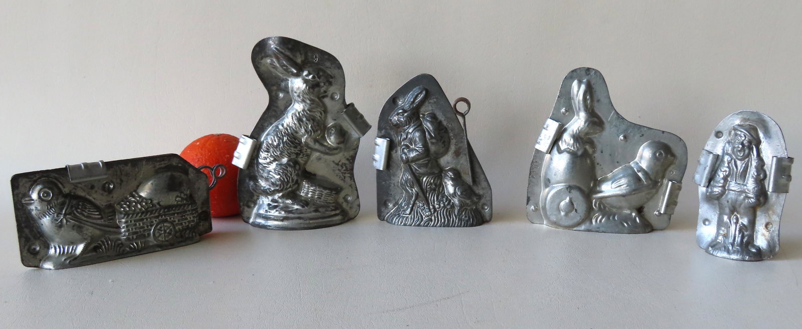Grouping of 5 Easter related double chocolate molds: Grouping of 5 Easter related double chocolate molds with open bottoms including: Baby chick pulling wagon with egg no. 8468 signed illegibly, a signed Anton Reich - Dresden No.6206 rabbit holding egg,