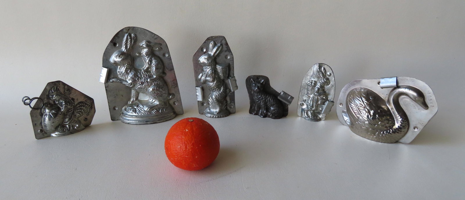 Grouping of 6 Easter related double chocolate molds: Grouping of 6 Easter related double chocolate molds with open bottoms including: A swan no. 16543 signed Vormenfabriek - Tilburg Holland - 6"W x 4 1/2"H; a rabbit with backpack marked no. 23 on both s