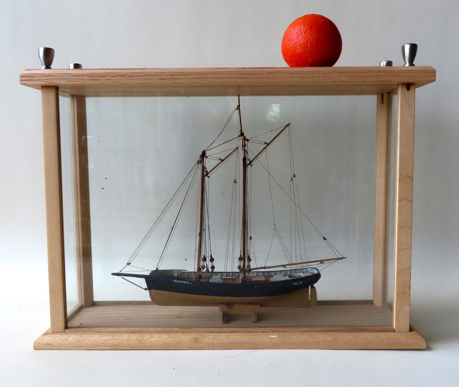 Wooden model of maritime pilot boat "Phantom #2",: Wooden model of maritime pilot boat "Phantom #2", operating circa 1870. Complete with rigging, deadeyes, block and tackles, original paint, etc. Mounted within a glass showcase with wooden frame. Earl