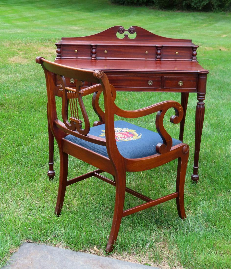 A high quality bench made Sheraton style mahogany desk: A high quality bench made Sheraton style mahogany desk having a step-back top with 3 drawers (hand dovetailed construction) and scrolled backsplash, over 3 drawers, cookie corners, and reeded legs. La