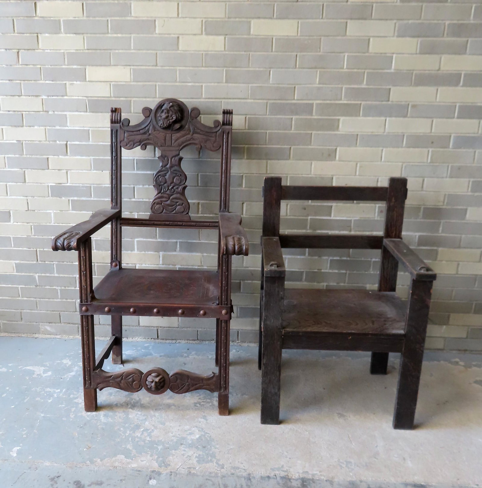 Two wooden early 20th century arm chairs including: A: Two wooden early 20th century arm chairs including: A medieval style with tooled leather seat and carved back splat, 27 3/4"W x 24"D x 49"H - small 1/2" saw mark on side of one of the arms, chair wobb