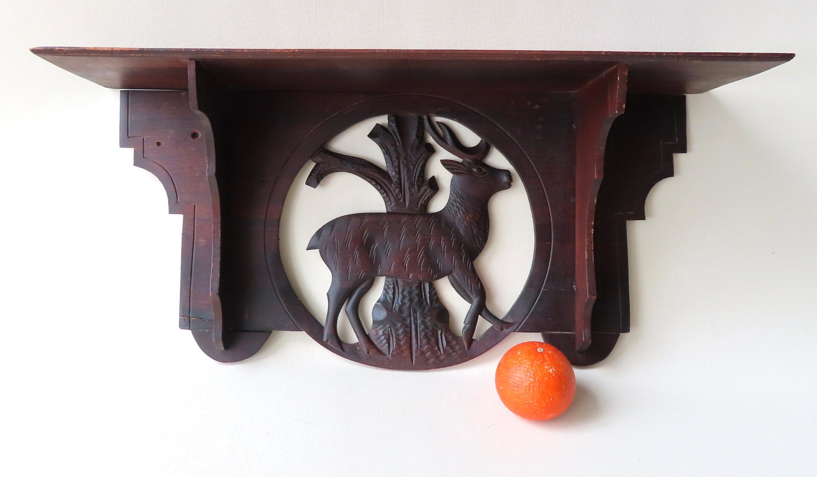 Victorian black walnut wall shelf with cutout of stag: Victorian black walnut wall shelf with cutout of stag under shelf. Note the 2 small repairs to the base of corners, else good condition. 25 1/2"W x 6 1/4"D x 11 3/4"H.