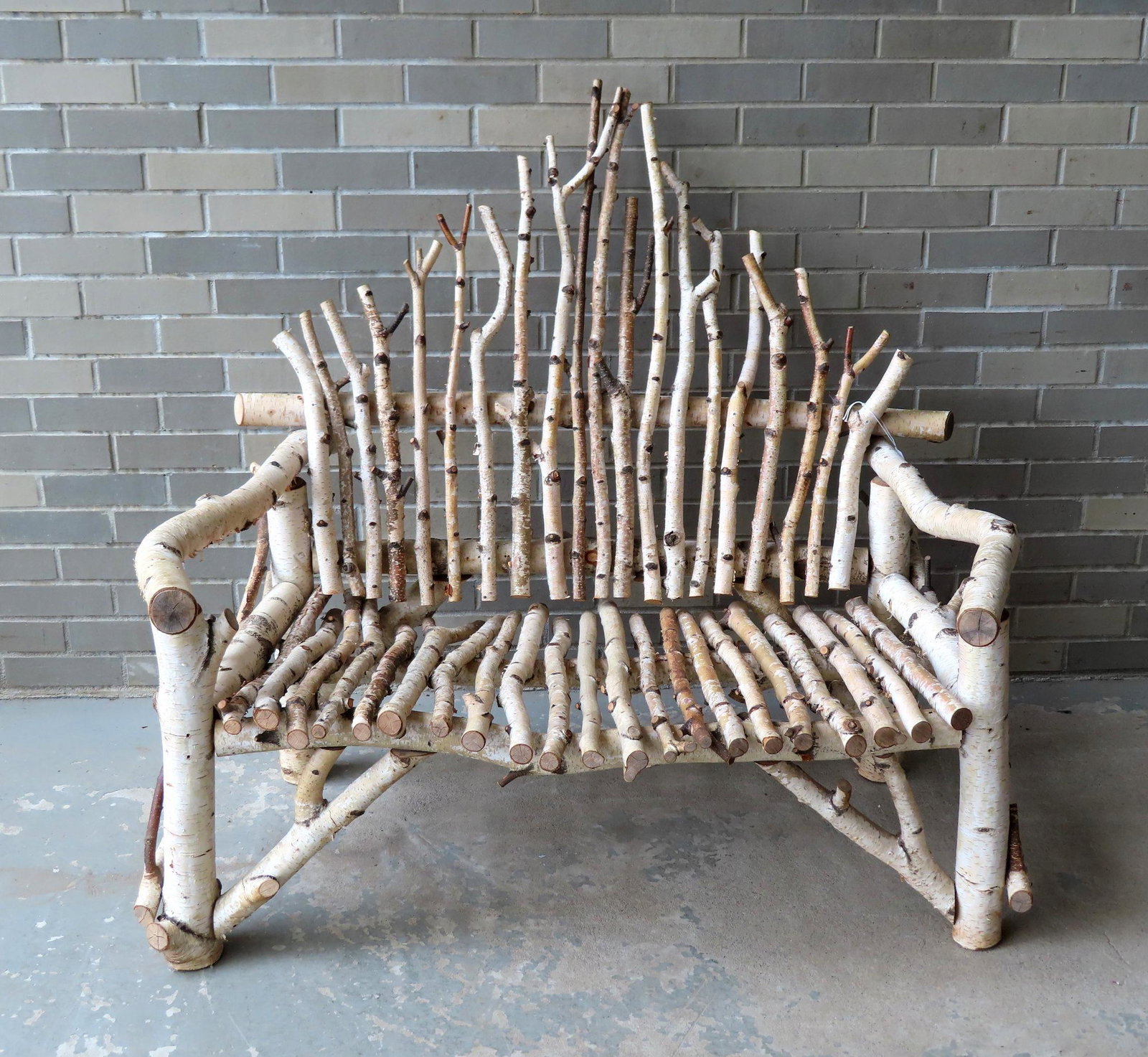 A white birch porch bench with hand made cushions: A white birch porch bench with hand made cushions, mid to late 20th century, very good condition. Used inside so it has not been weathered. Measures 44"W 28"D x 42 1/4"H. Sold with a throw blanket in 