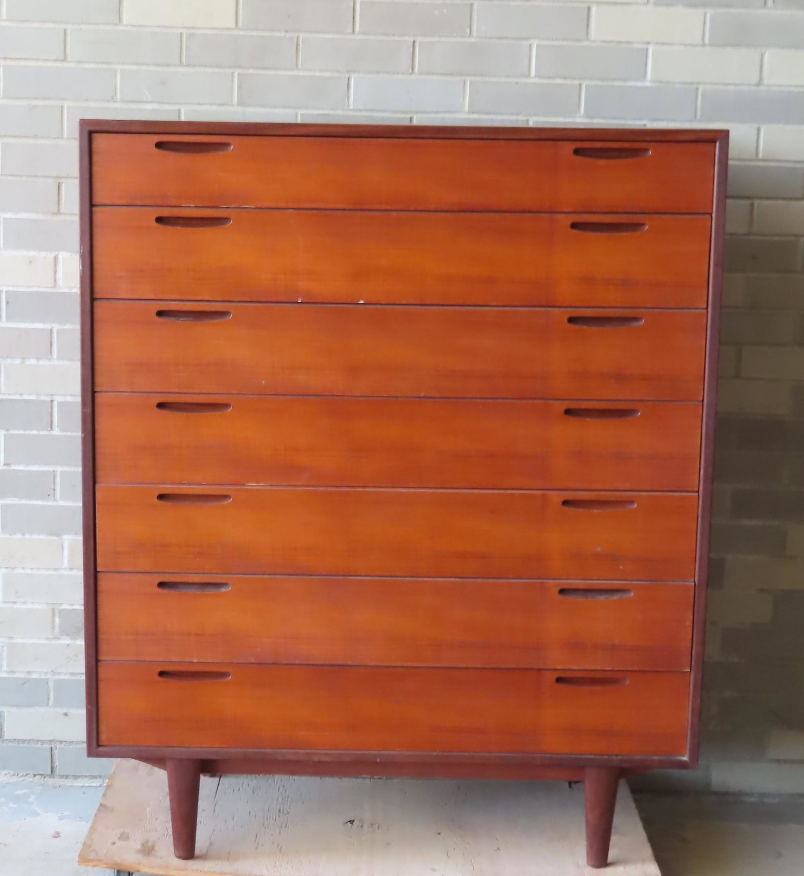 A Danish modern Selig teakwood tall chest with 6: A Danish modern Selig teakwood tall chest with 6 drawers, very good condition. The red and white label impressed into the side of the top drawer reads "Made and Finished in Denmark / Imported by Selig