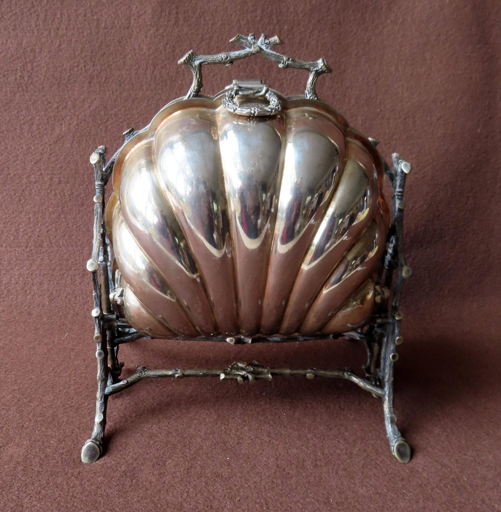 A Fenton Bros. Sheffield folding silver plate biscuit: A Fenton Bros. Sheffield folding silver plate biscuit box, with hallmarks and marked # 3549. The rustic twig form sides, legs and handle surround the shell form double biscuit holder, that when open r