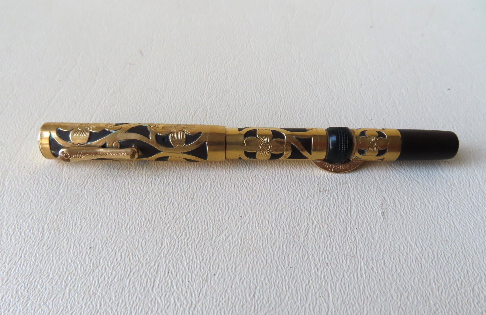A Conklin Crescent gold plated filigree fountain pen,: A Conklin Crescent gold plated filigree fountain pen, patent date May 28, 1918 - Waterman's Ideal nib - very good condition - 5 1/8"L.