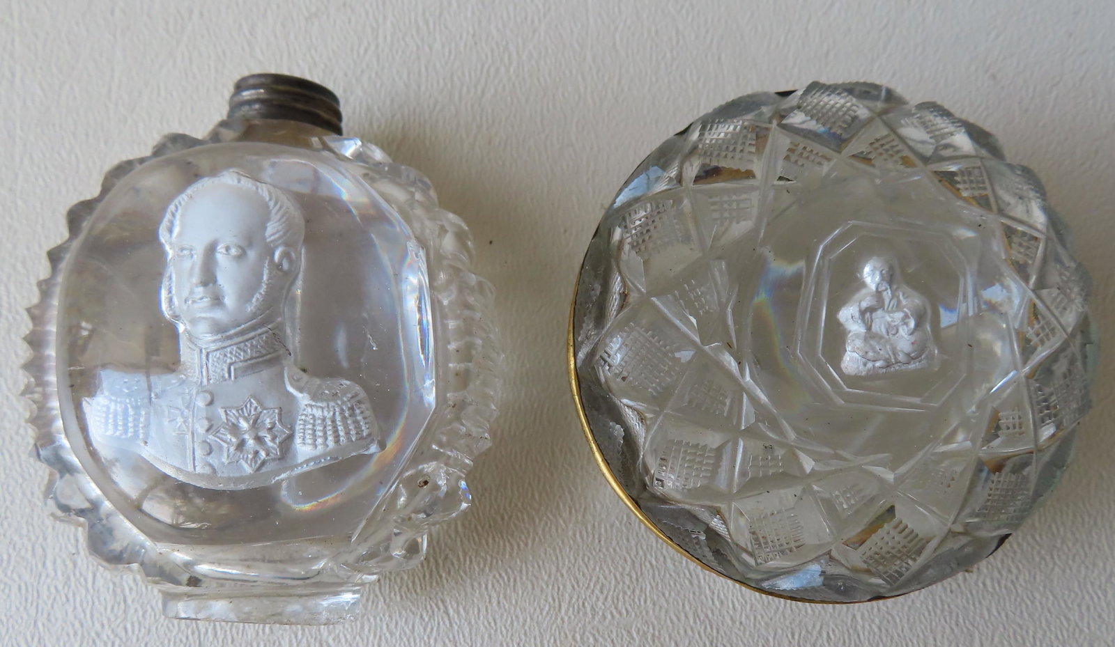 A cut glass snuff box and a snuff bottle, both with: A cut glass snuff box and a snuff bottle, both with sulphide cameo portraits including: A circular box with portrait of an oriental gentleman - 2 3/8" diameter x 1"H - some surface scratches, otherwis