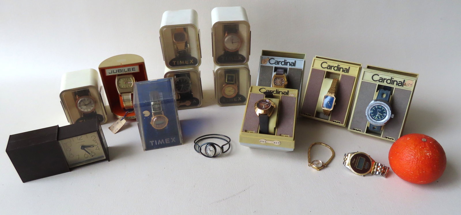A grouping of fourteen 1970's era wrist watches, most: A grouping of fourteen 1970's era wrist watches, most in original boxes, and 1 travel clock, including: 6 Timex watches in original boxes including a "Marathon" watch ; 1 Longines-Wittnauer Jubilee (o