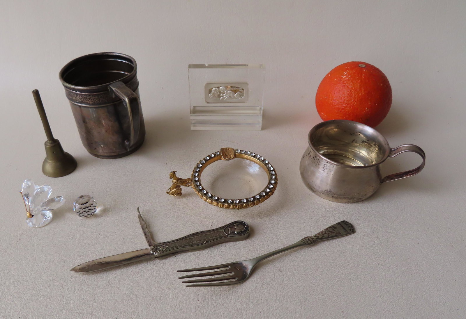 Grouping of decorative objects including: A sterling: Grouping of decorative objects including: A sterling silver baby's cup engraved "David" - dings along the edge of base; an unmarked silver pocket knife with pipe cleaning blade - the knife blade heavi