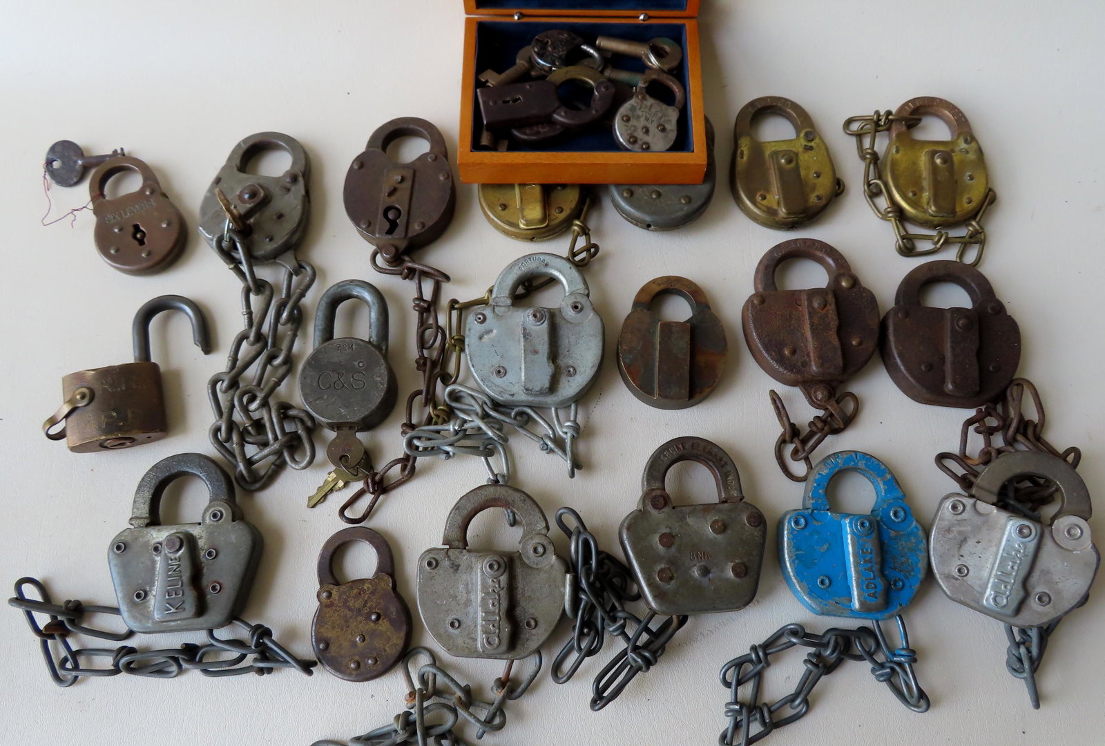 Grouping of 24 vintage padlocks including 5 miniature: Grouping of 24 vintage padlocks including 5 miniature locks, some railroad related. Includes "Adlake RIP Track" plus other Adlake's, several Keline, PRR, C & S, brass "Six Levers", Wilson Rohannan Bro