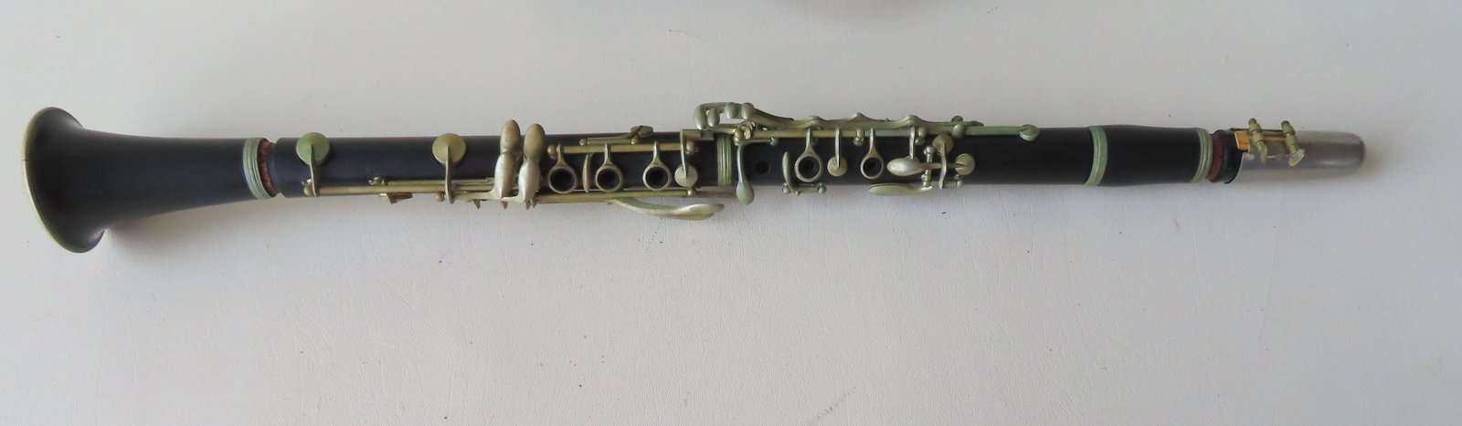A clarinet signed "LA Couture / Paris " - serial number: A clarinet signed "LA Couture / Paris " - serial number A277 - the bell with a very tight and small hairline on exterior near rim, else good condition with original carrying case.