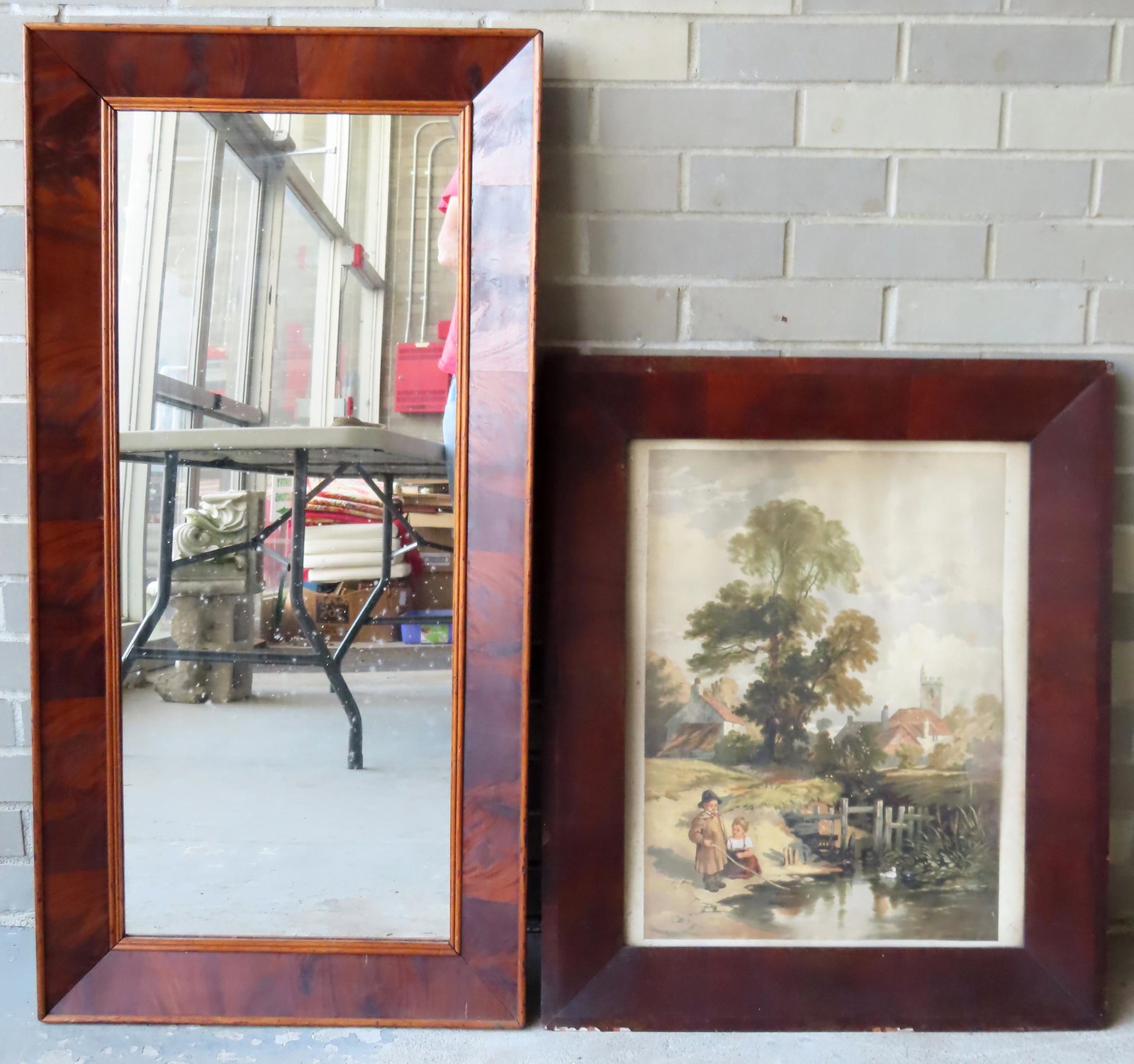 An Empire mahogany ogee mirror and an Empire mahogany: An Empire mahogany ogee mirror and an Empire mahogany frame currently holding an early print titled on reverse "The Young Anglers" (printed in London), both circa 1840-60. The former measures 40 1/4" 